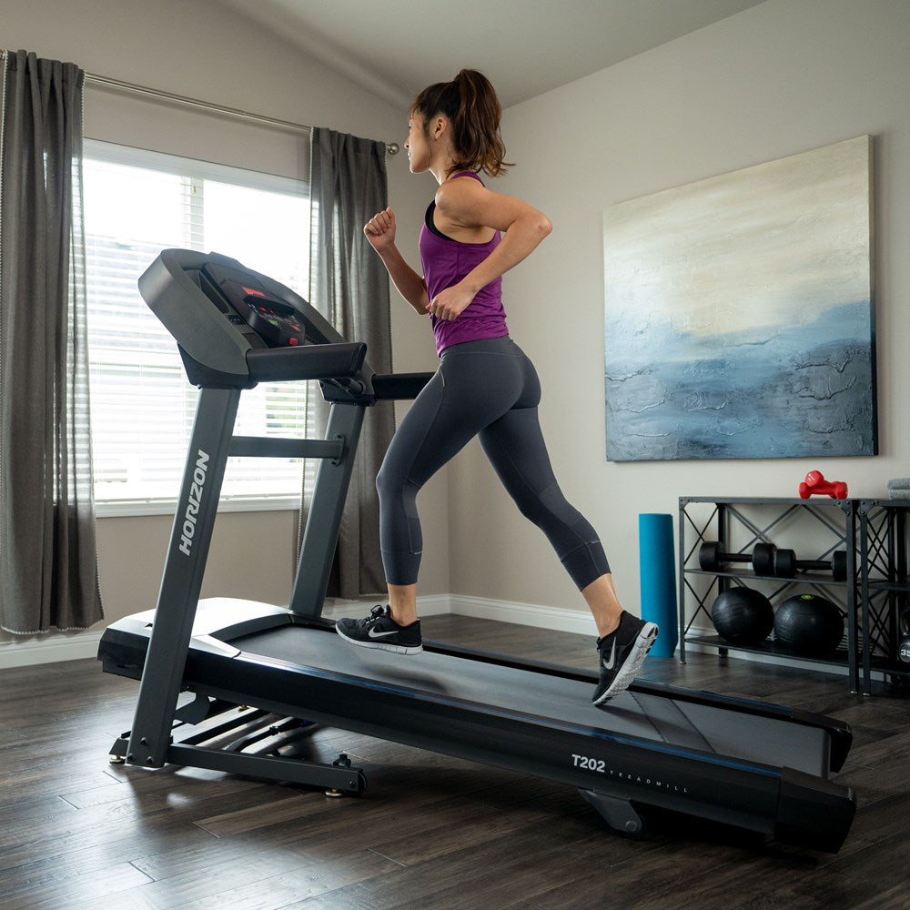 woman running on a treadmill from the gym and treadmill surgeon